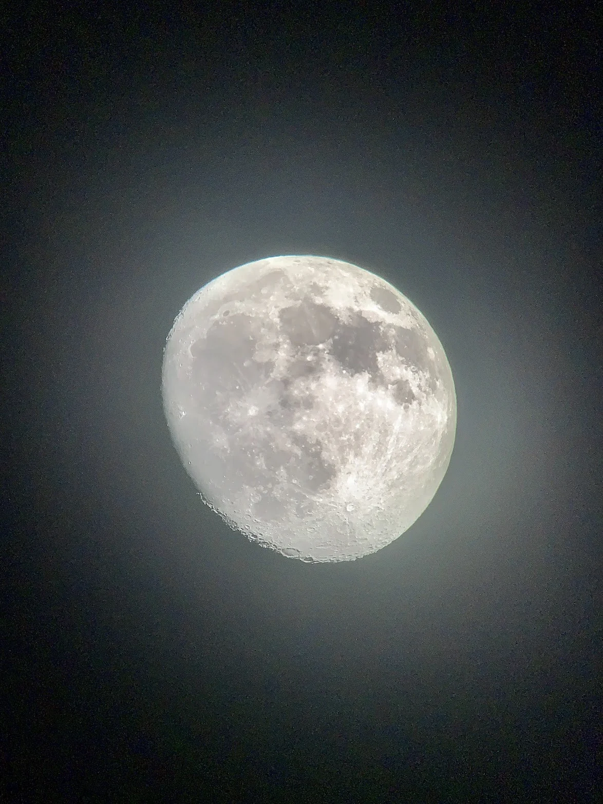 Photograph of a full Moon through haze