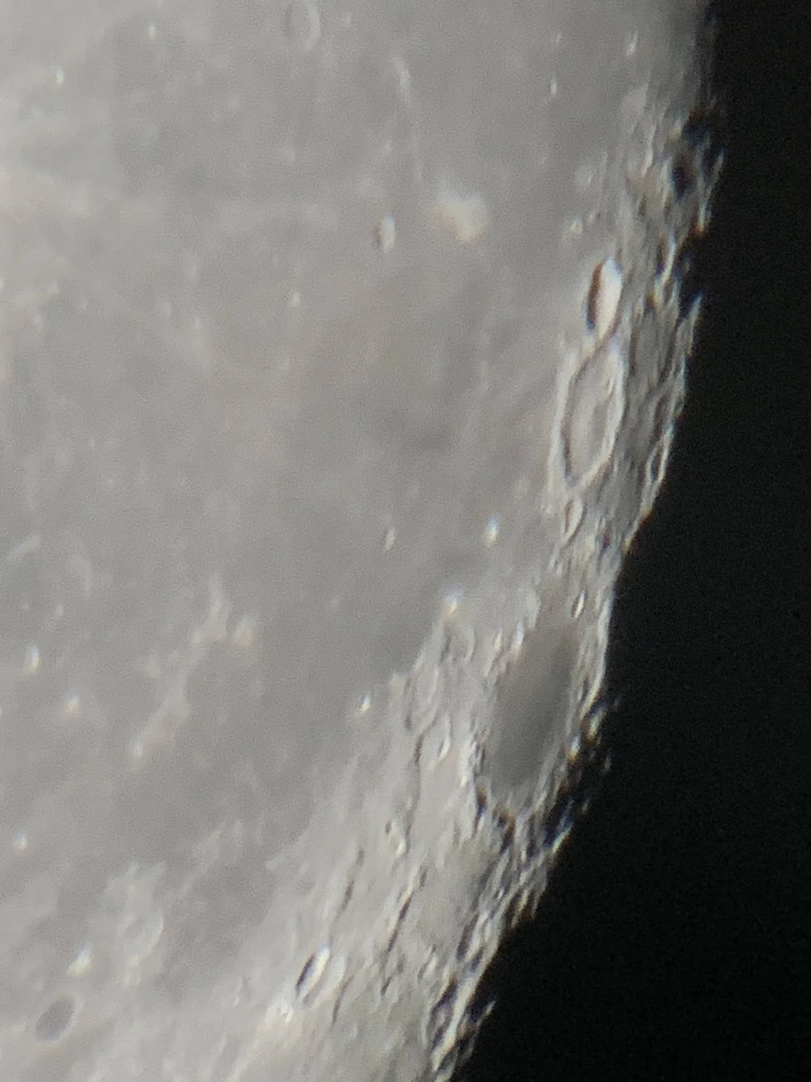 Close-up photograph of the lunar surface near the terminator