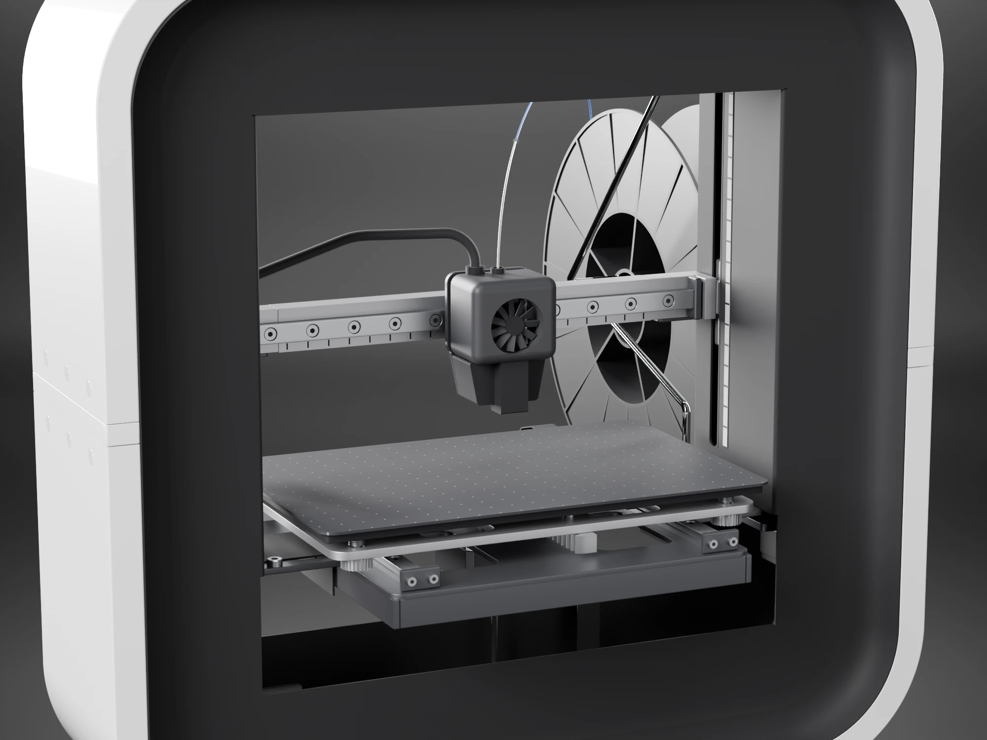 The print system seen through the window of the housing: a graphite toolhead with a round fan on an aluminium beam that runs from wall to wall, a printed scale on the right wall, and a dark plate with a dot grid over an aluminium carrier