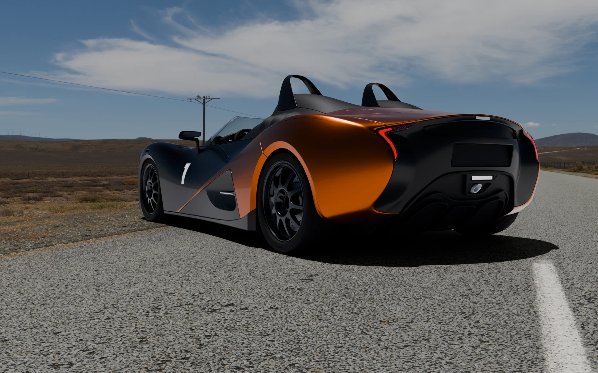 The black and orange No. 1 from behind on an empty desert road, seen from low on the tarmac