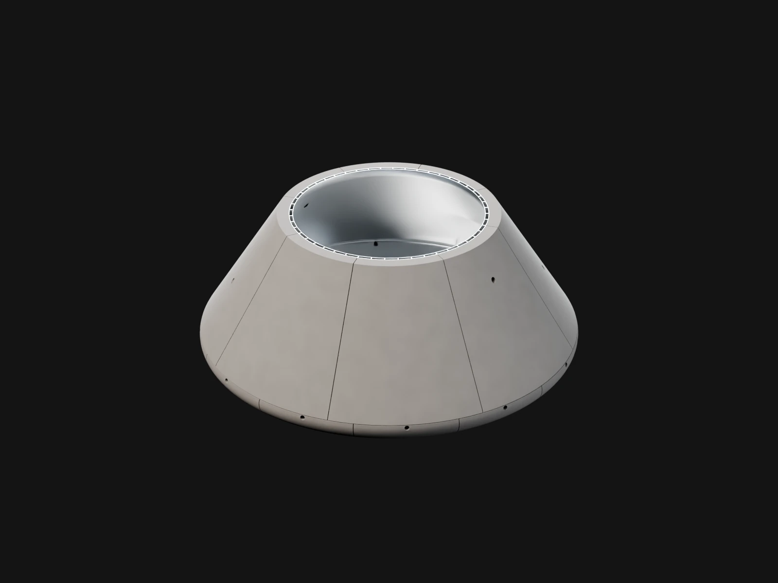 A grey truncated cone with an open top over a dark dish