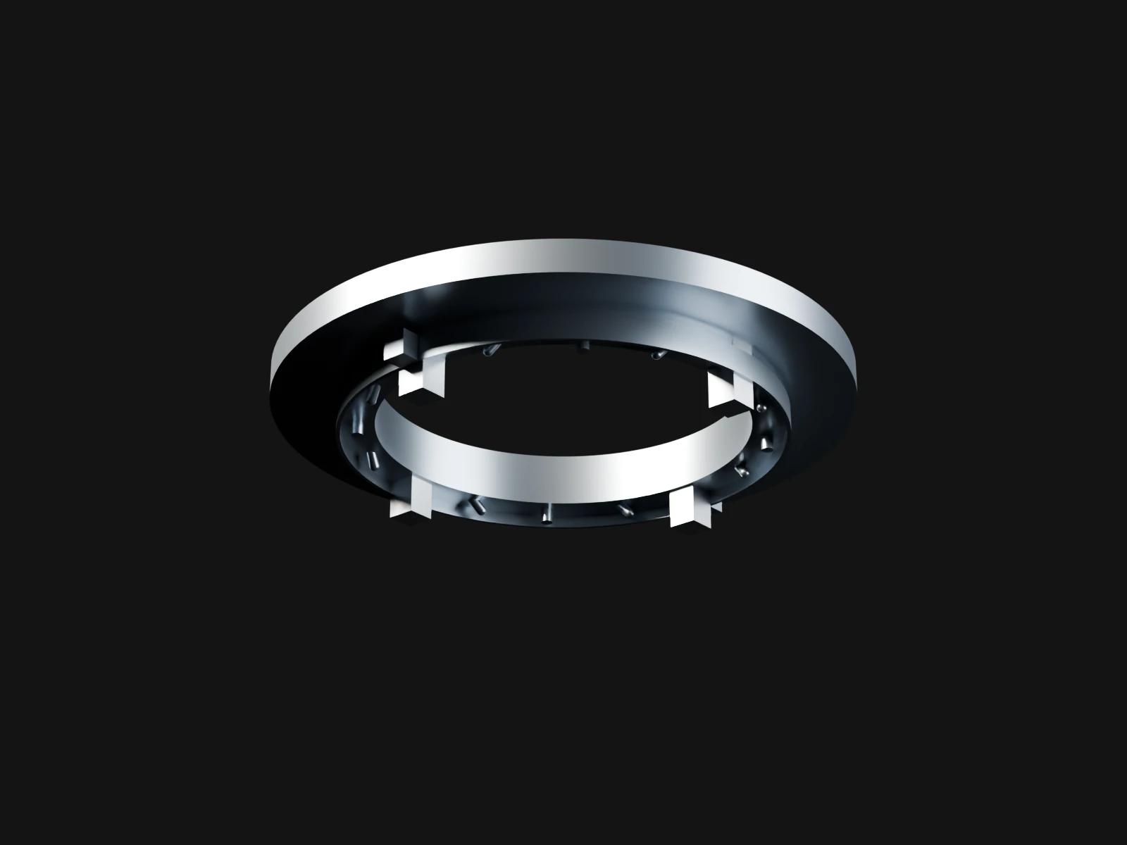 A silver ring beam seen from below with a clamp band and small pushers round its rim