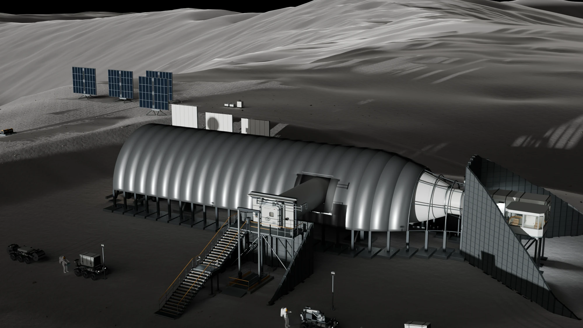 The ribbed metal vault on its footings over the habitat before any regolith is placed, with the stair and airlock at the side, the glazed OSCAR room at the far end and solar arrays standing beyond.