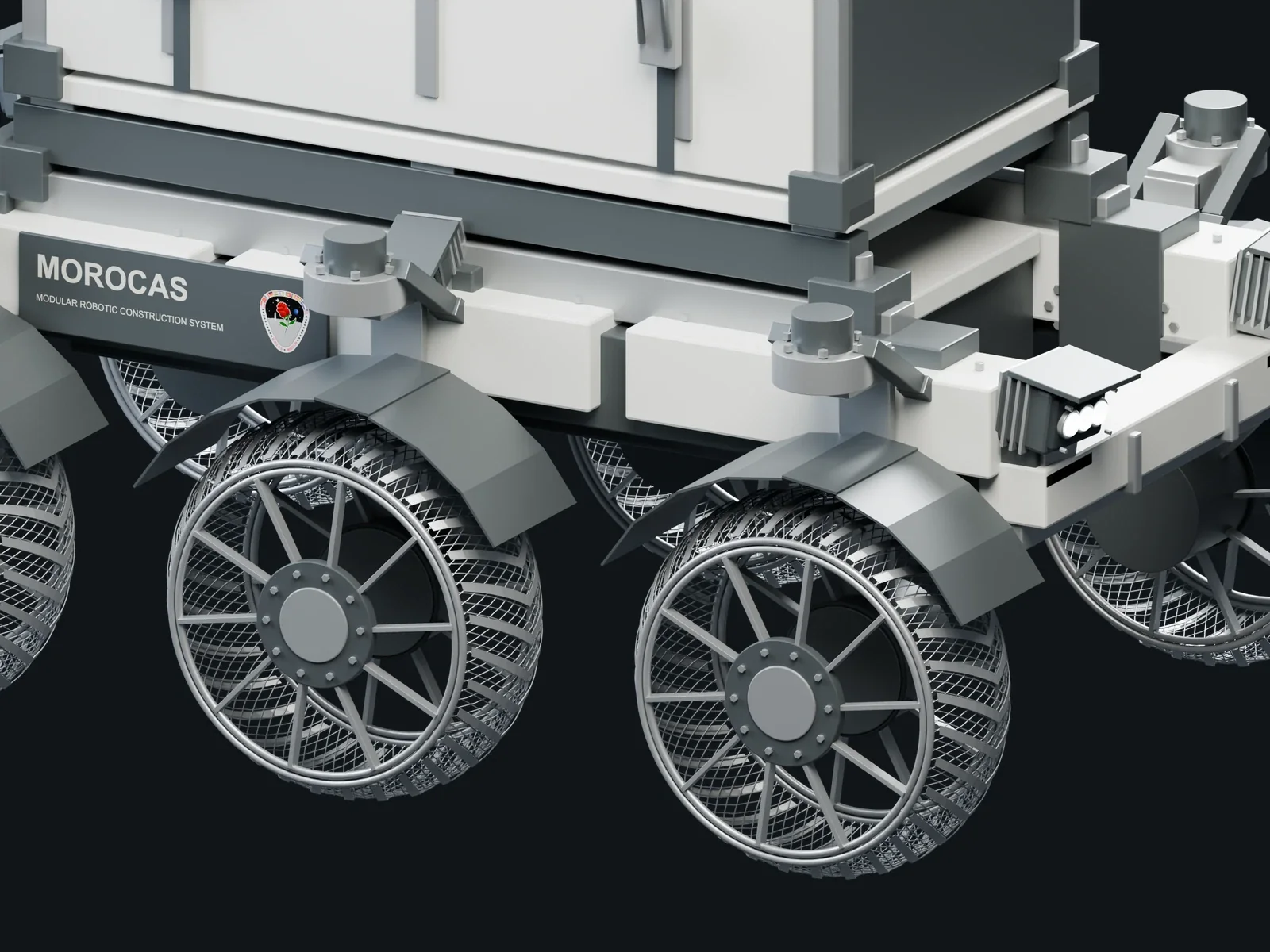 Close view of the MOROCAS woven wheel, steering yoke, reduction drive and structural interface.