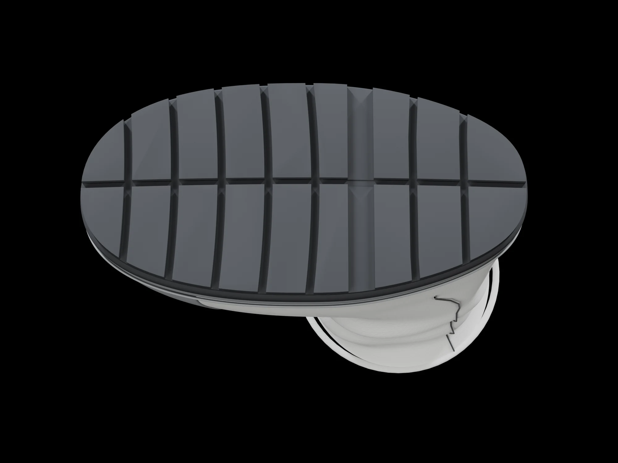 The sole of the boot seen from below: a dark oval of rubber blocks separated by channels across the foot and one channel along its length, inside a grey rim