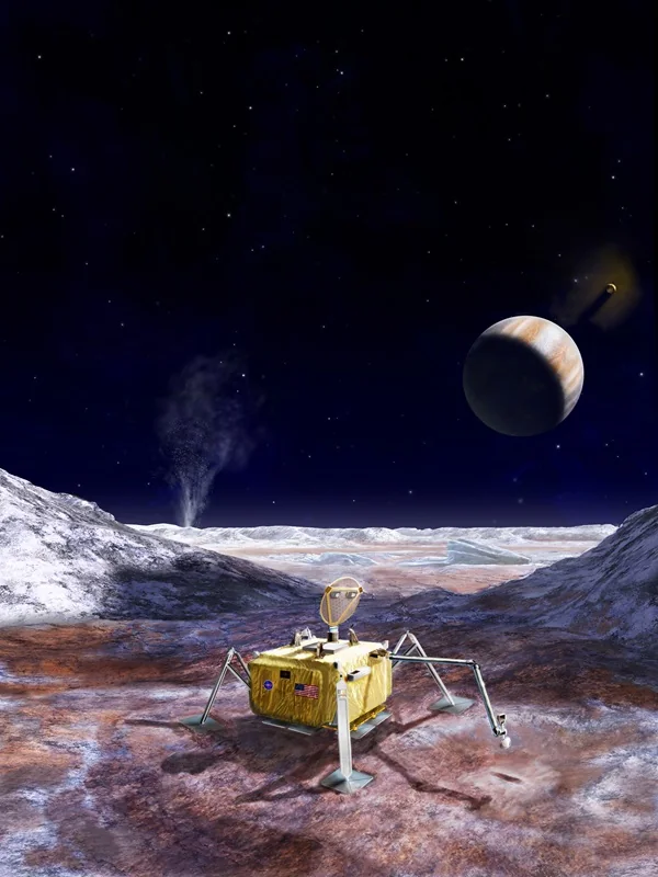 A gold four-legged lander with a dish antenna and a sampling arm on reddish ice, a plume rising behind it and Jupiter in a black sky