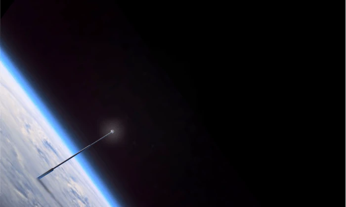 A long thin tower rising from Earth's surface through the blue limb of the atmosphere, a glow at its tip against black space