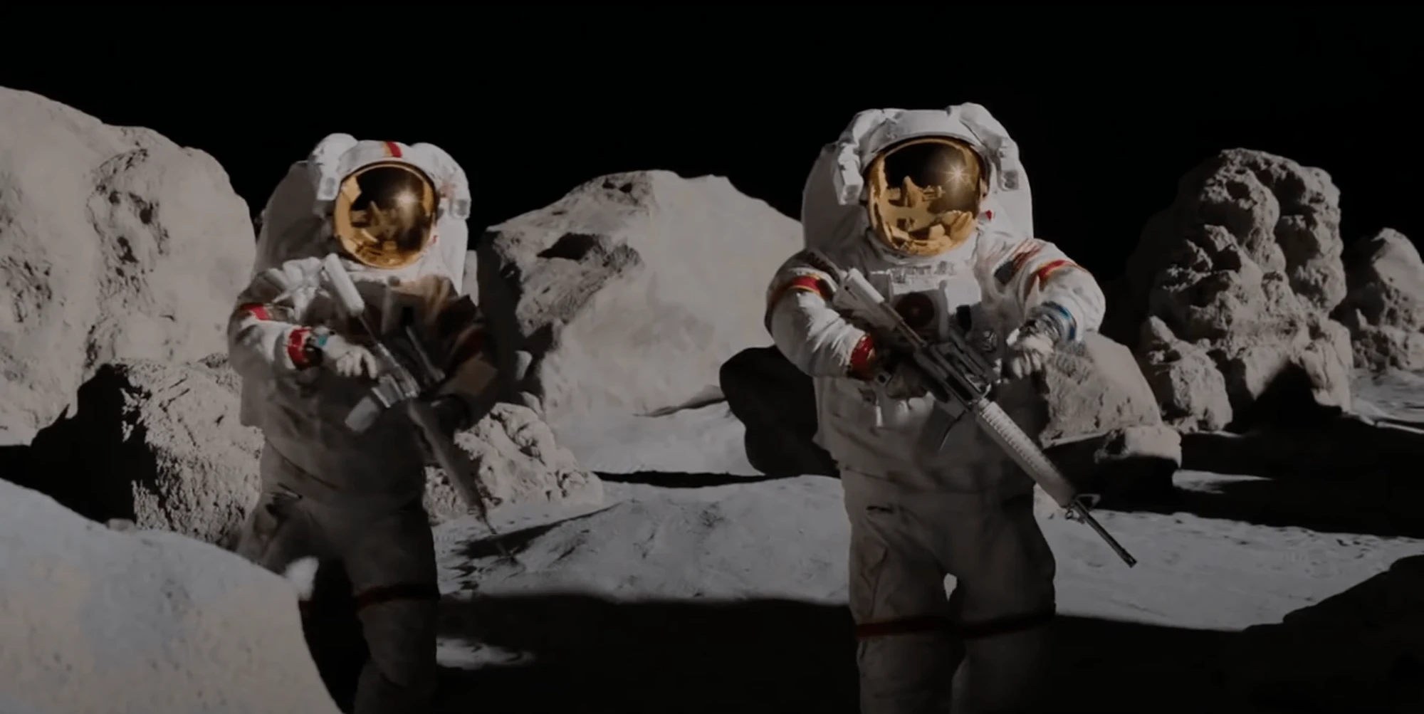 Two astronauts with gold visors aiming rifles among boulders on the Moon